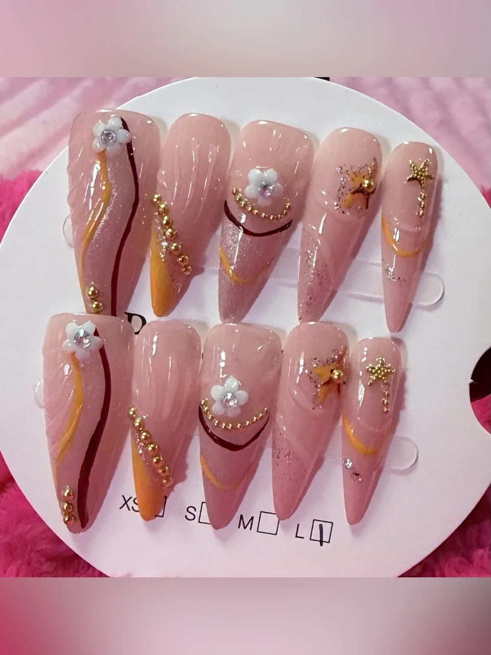 Nude Pink Stiletto Press-On Nails with Gold Accents and Floral Charms